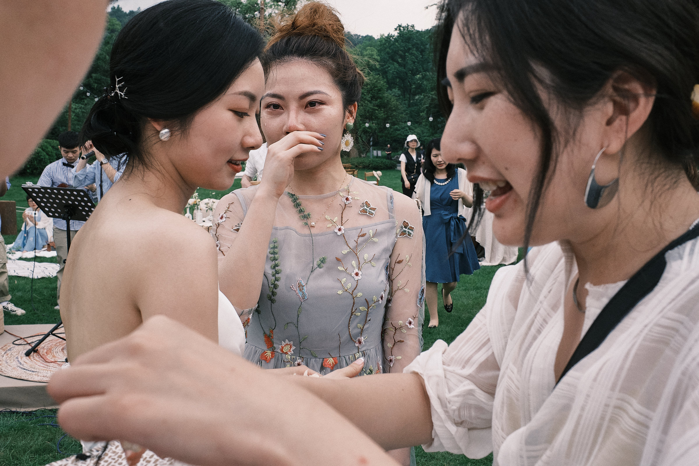 friend of bride looks at her with tears in her eyes
