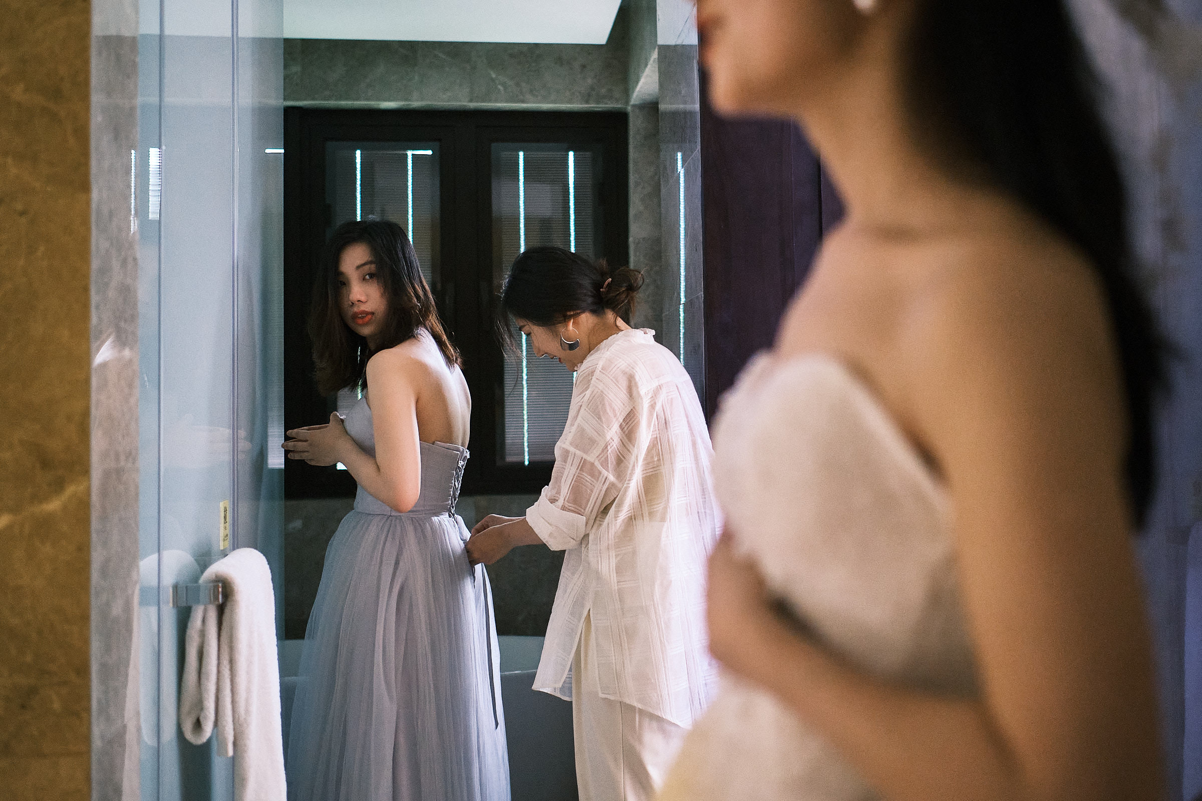 Bride And Bridemsaid Puts On Dress For The Wedding In Hangzhou China