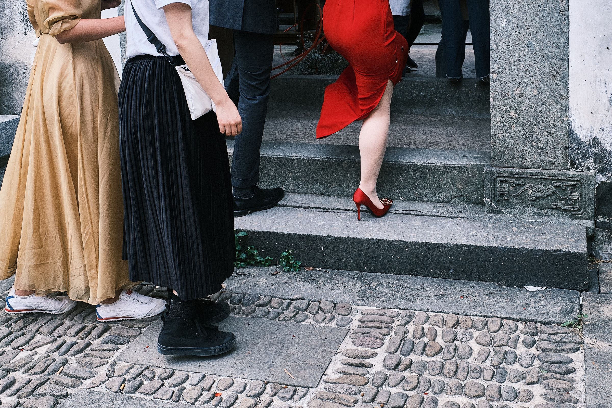 Feet Of Wedding Guests Entering Ceremony Venue And Bride Dressed In Red Stands Out In Hangzhou China