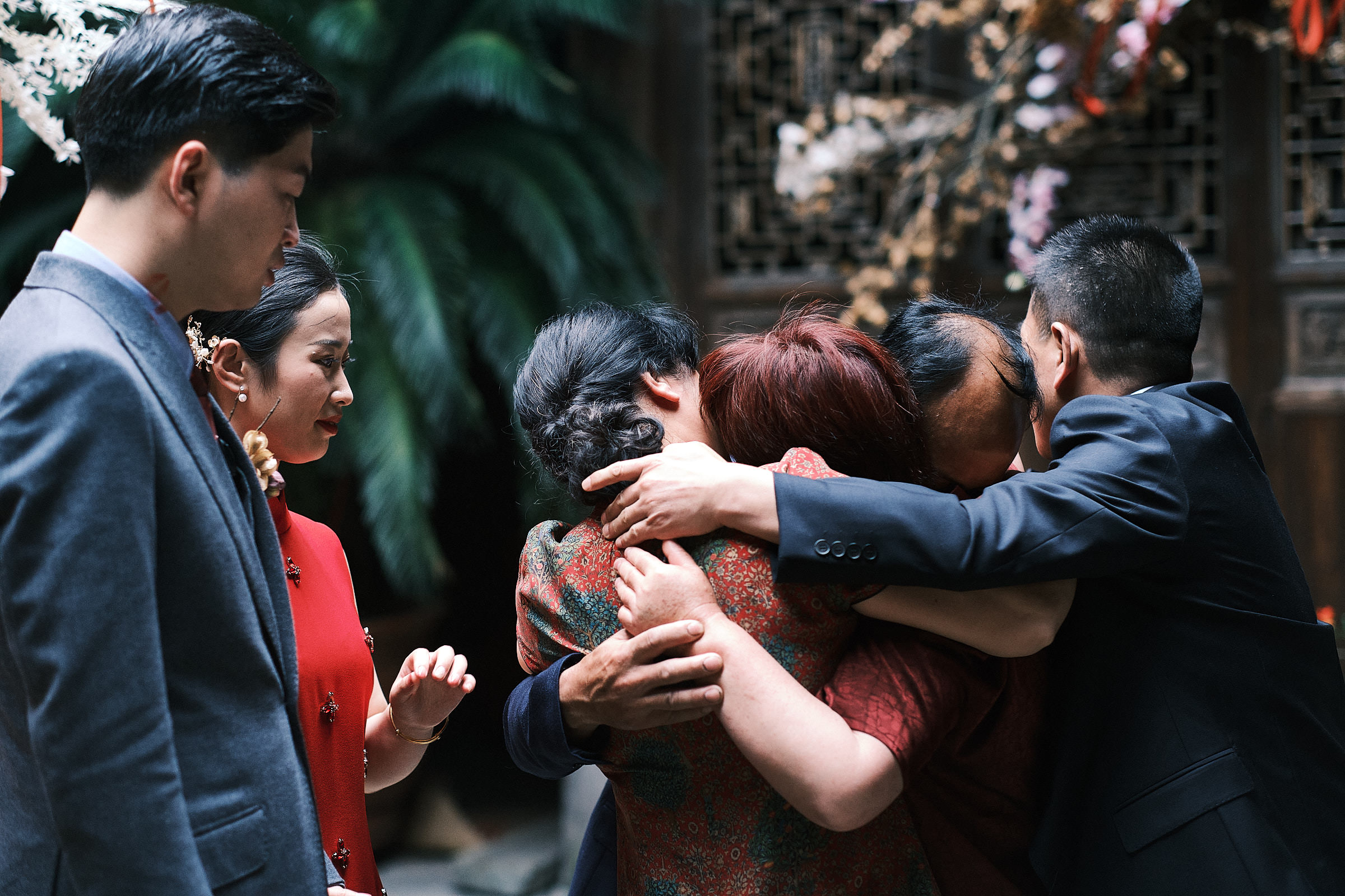 Bride And Groom Family Share An Emotive Embrace At The End Of Wedding Ceremony In Hangzhou China