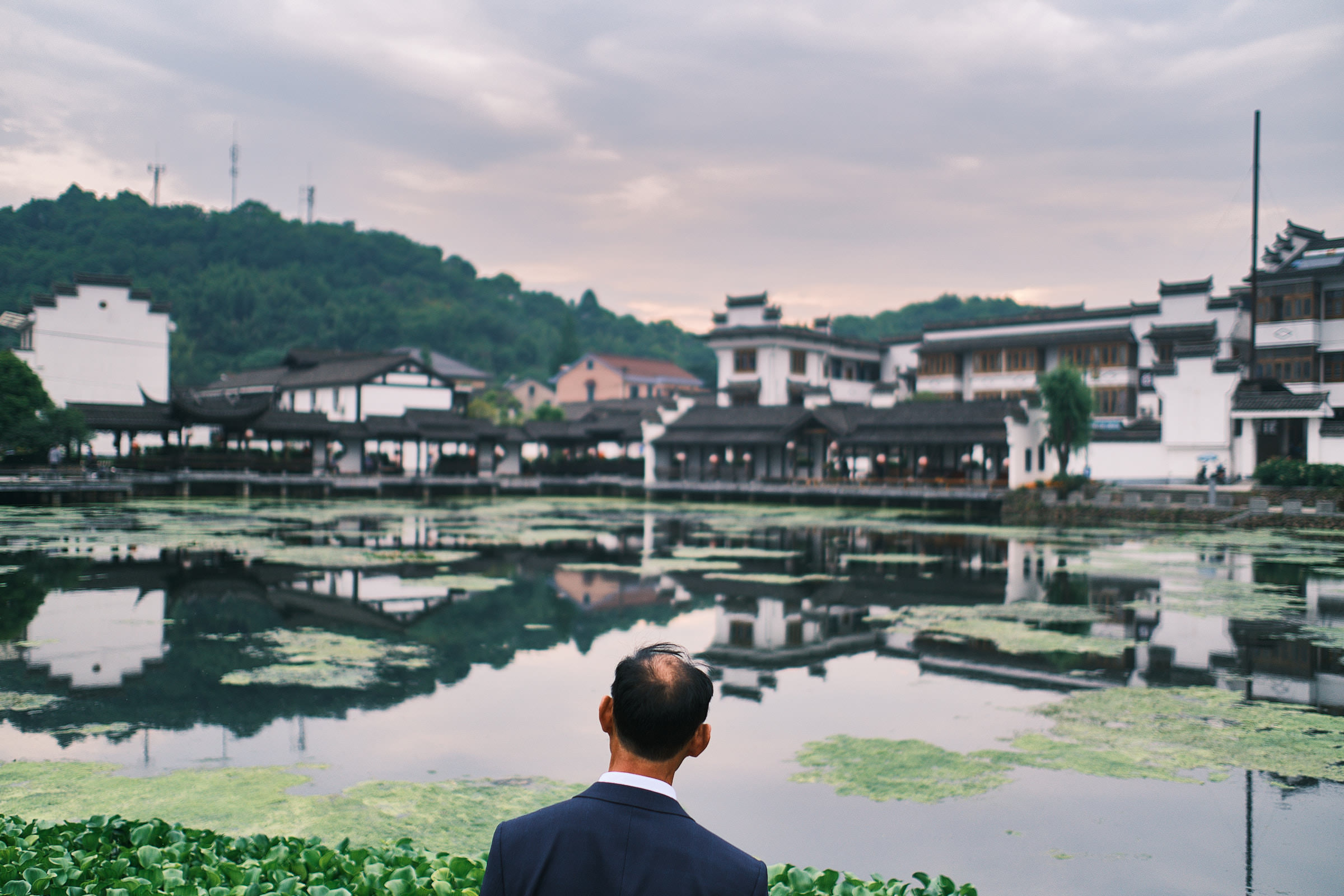 Man Looking At A Lake In Hangzhou China