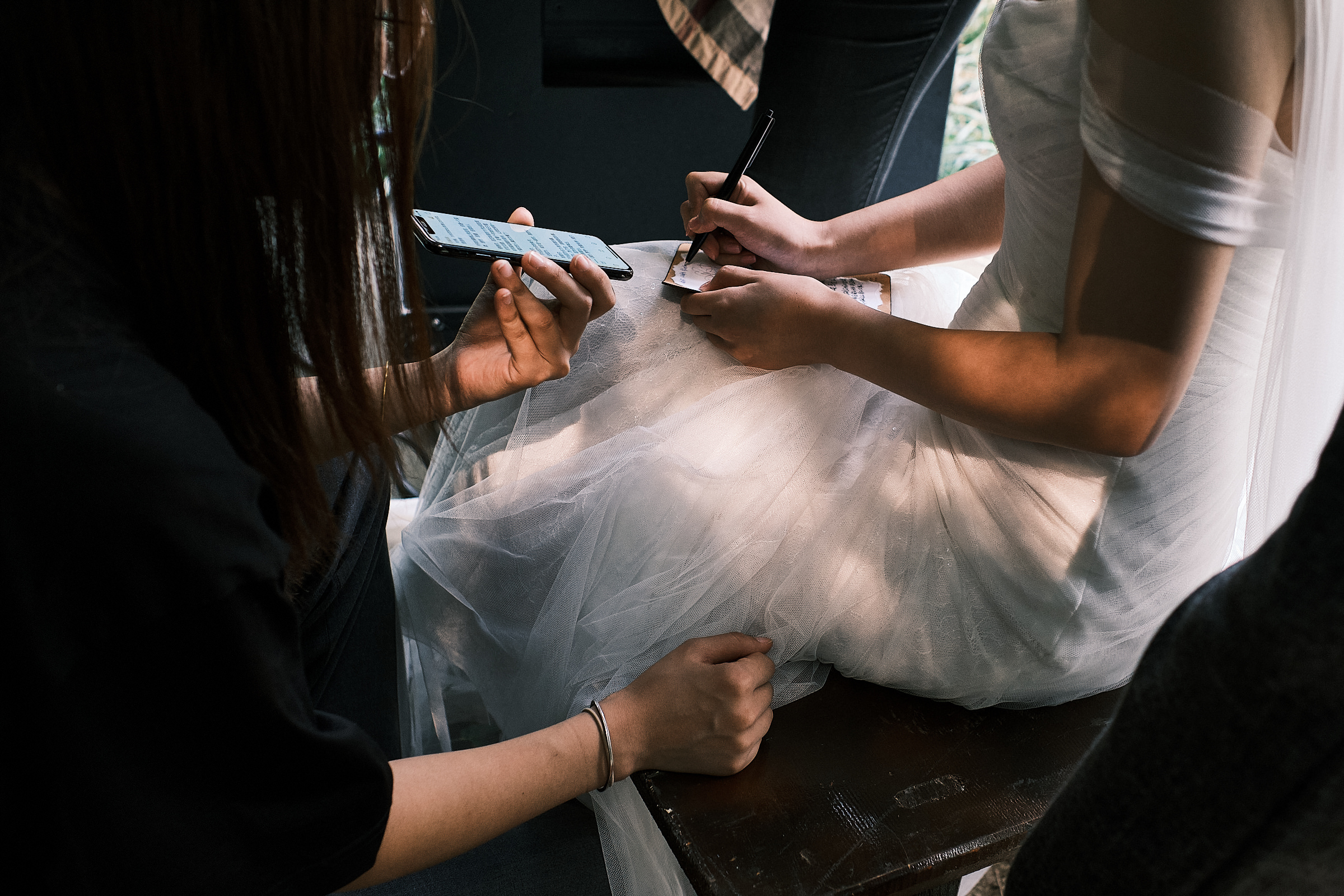 Bride Writes Her Vows As Someone Holds Phone For Her To See