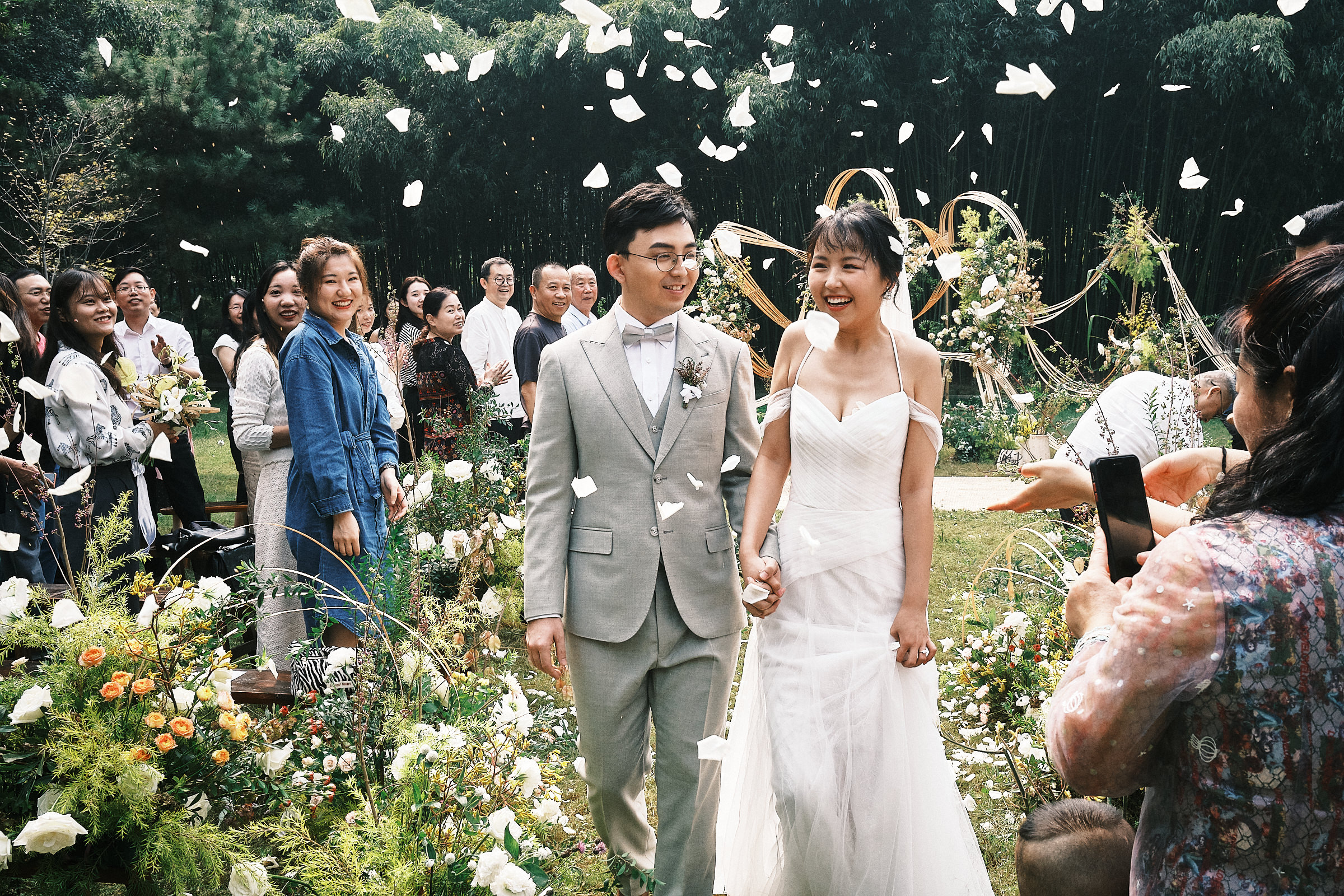 Bride And Groom Exit Ceremony With Petals Thrown In The Air