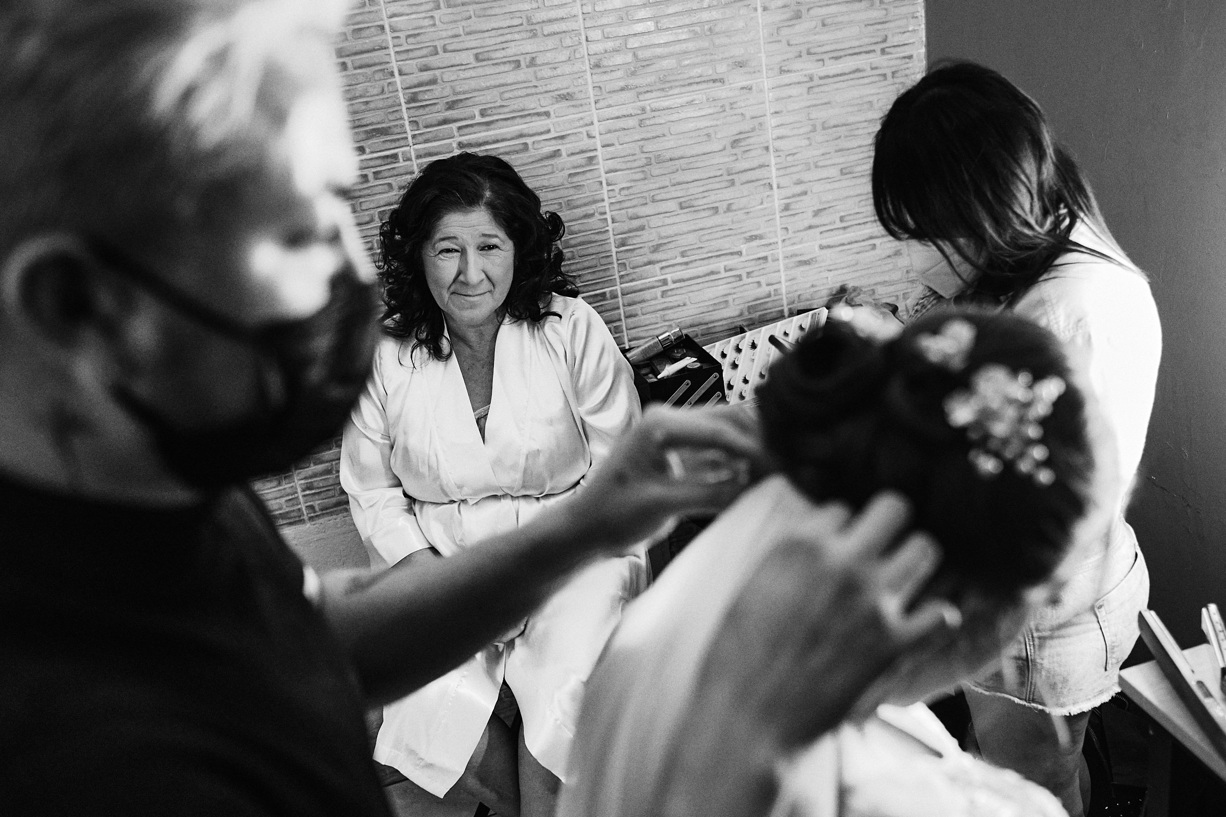 Black And White Photo Of Mom Of The Bride Looking At Her Daughter As She Wears The Veil For Ceremony