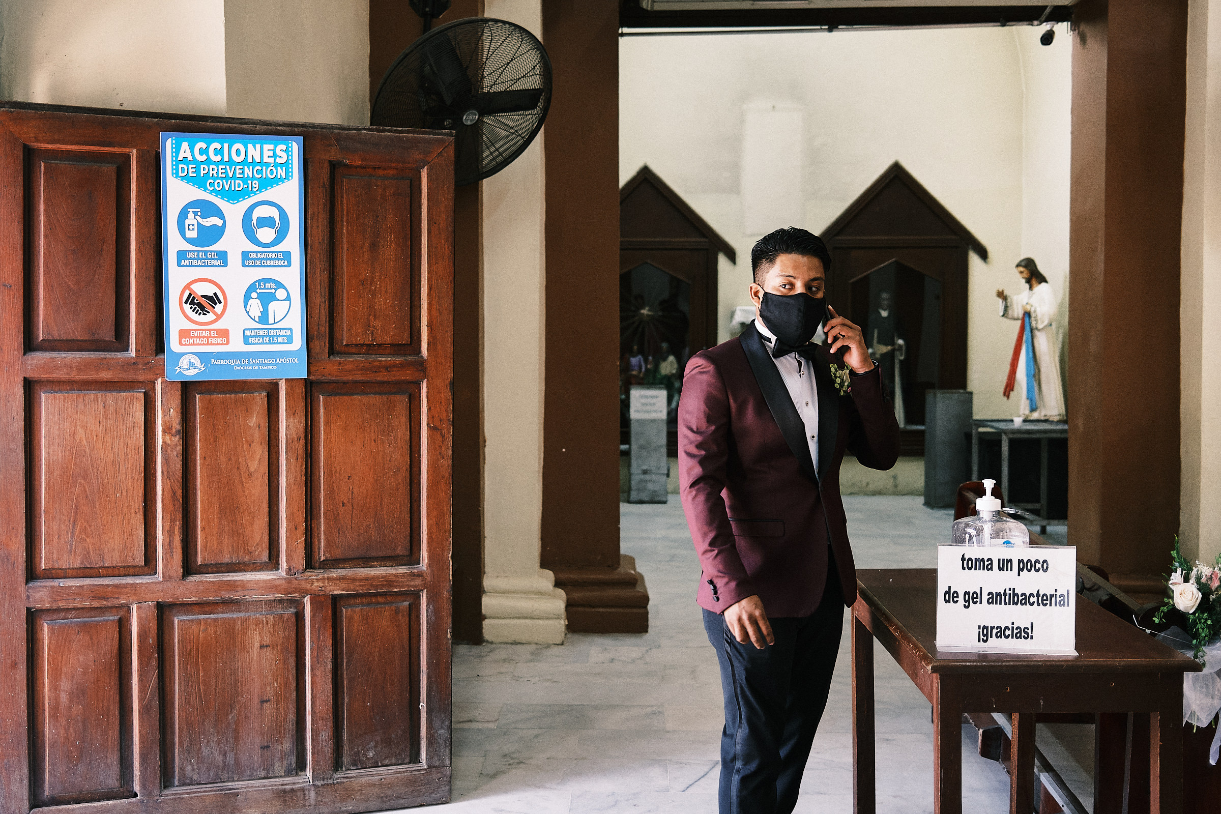 Masked Groom Calls On The Phone And Waits For The Bride To Arrive For Ceremony At The Cathedral