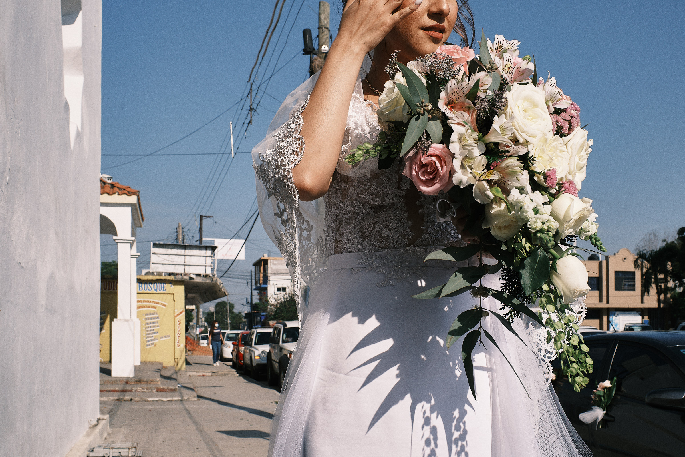Bride Holds Bouquet Of Flowers And Waits Outside The Church
