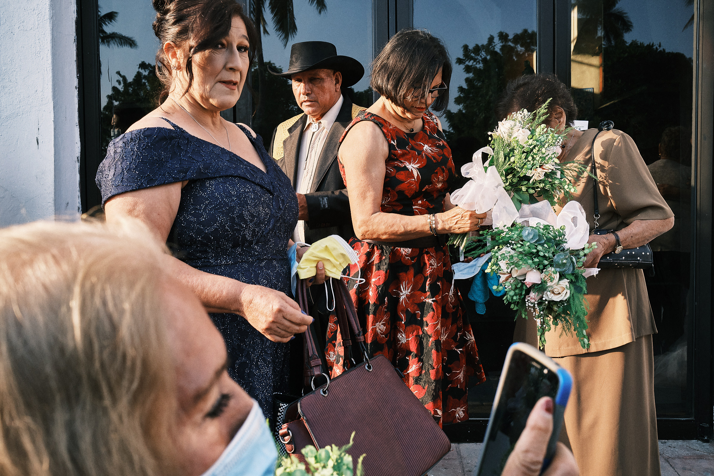 Parents Of The Bride Exit The Church In Altamira While Someone Holds Flowers