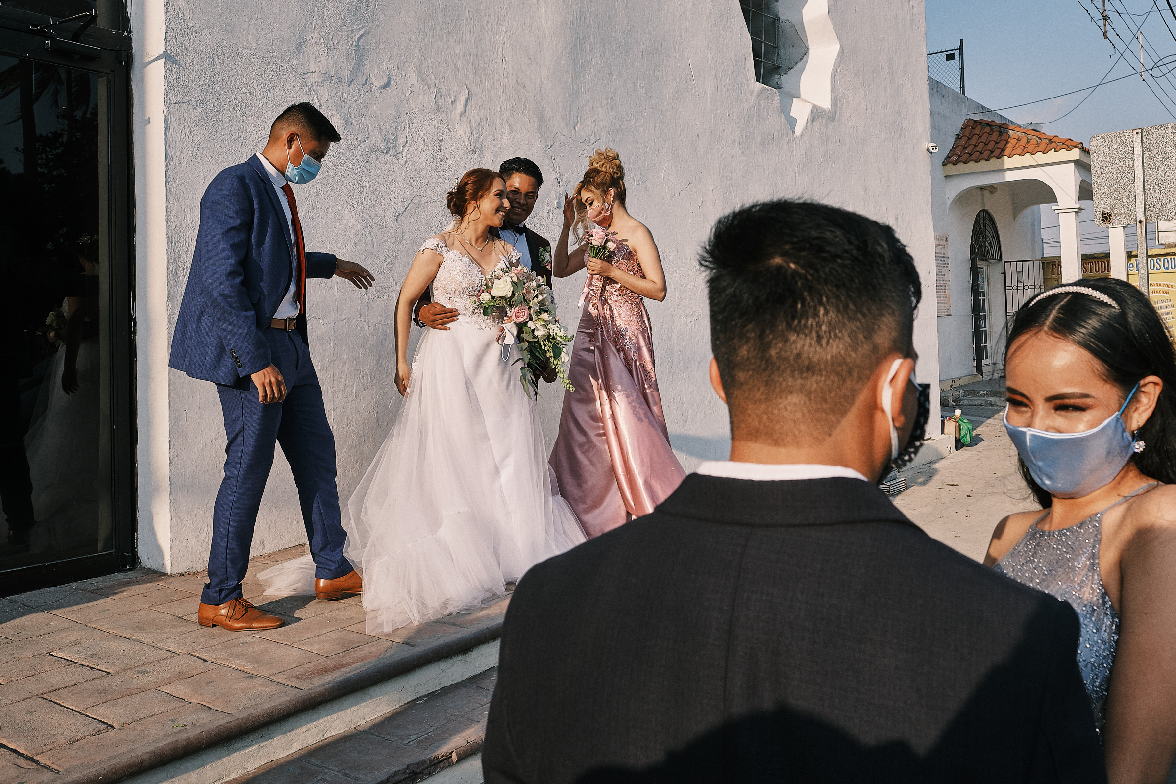 Couple Takes Photos With Guests While Sister Of The Bride Haves A Happy Talk With Her Partner