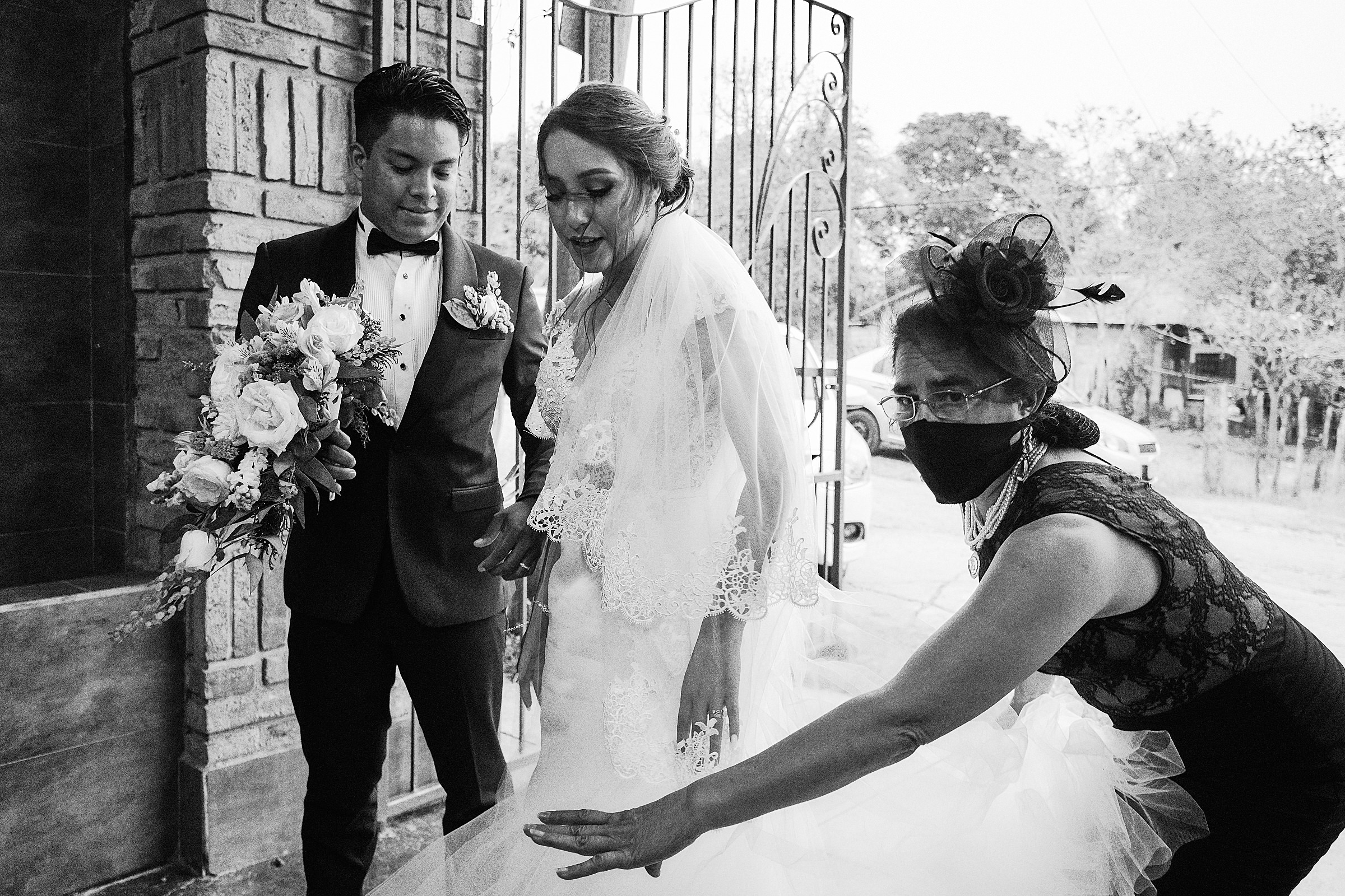 Lady Helps Bride And Groom To Prepare Before Their Entrance At Wedding Reception In Quinta El Arrayan