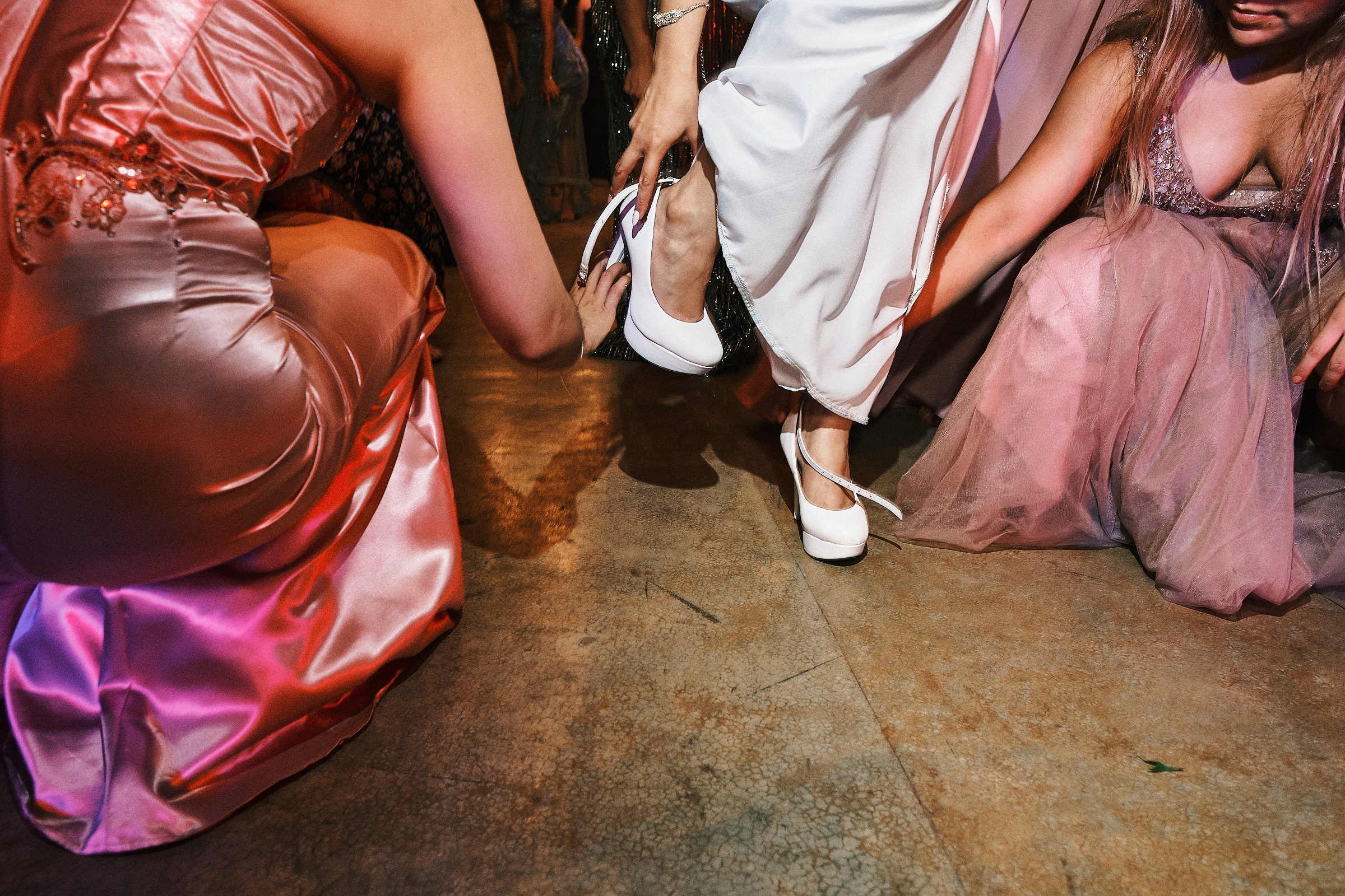 Bridesmaids Help Bride Fix Her Shoes Before Dancing At Reception In Quinta El Arrayan Tampico