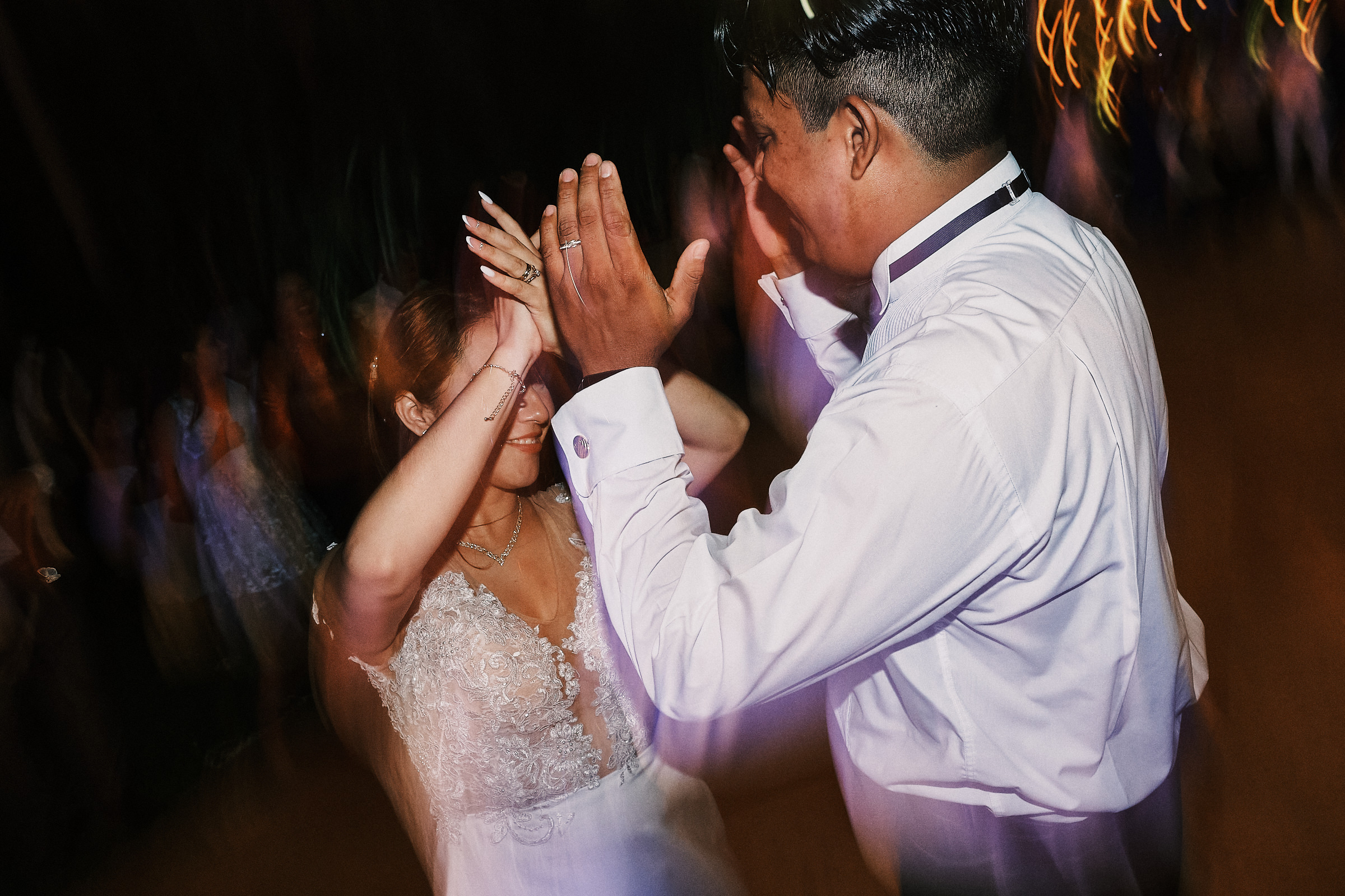 Bride And Groom Dance Together Late In The Evening