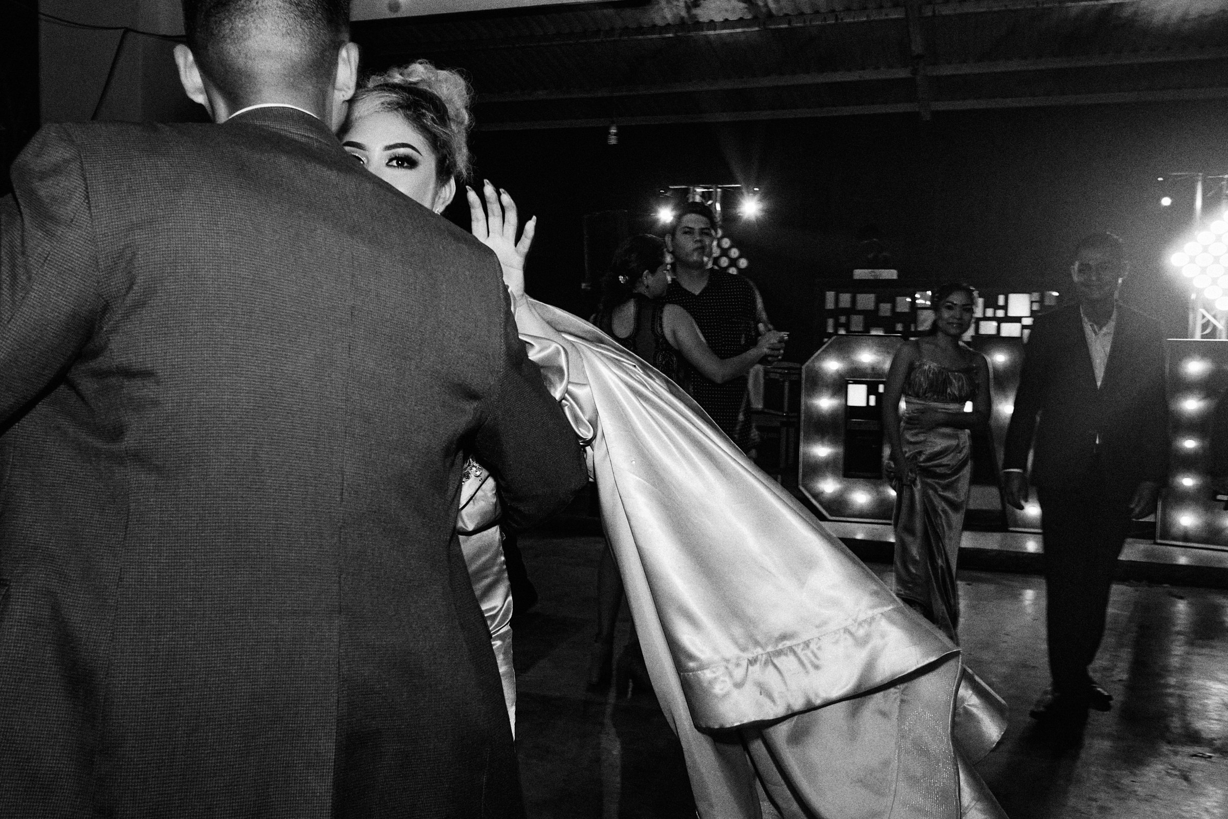Bridesmaid Looks Straight At The Camera During Wedding Reception Dancing