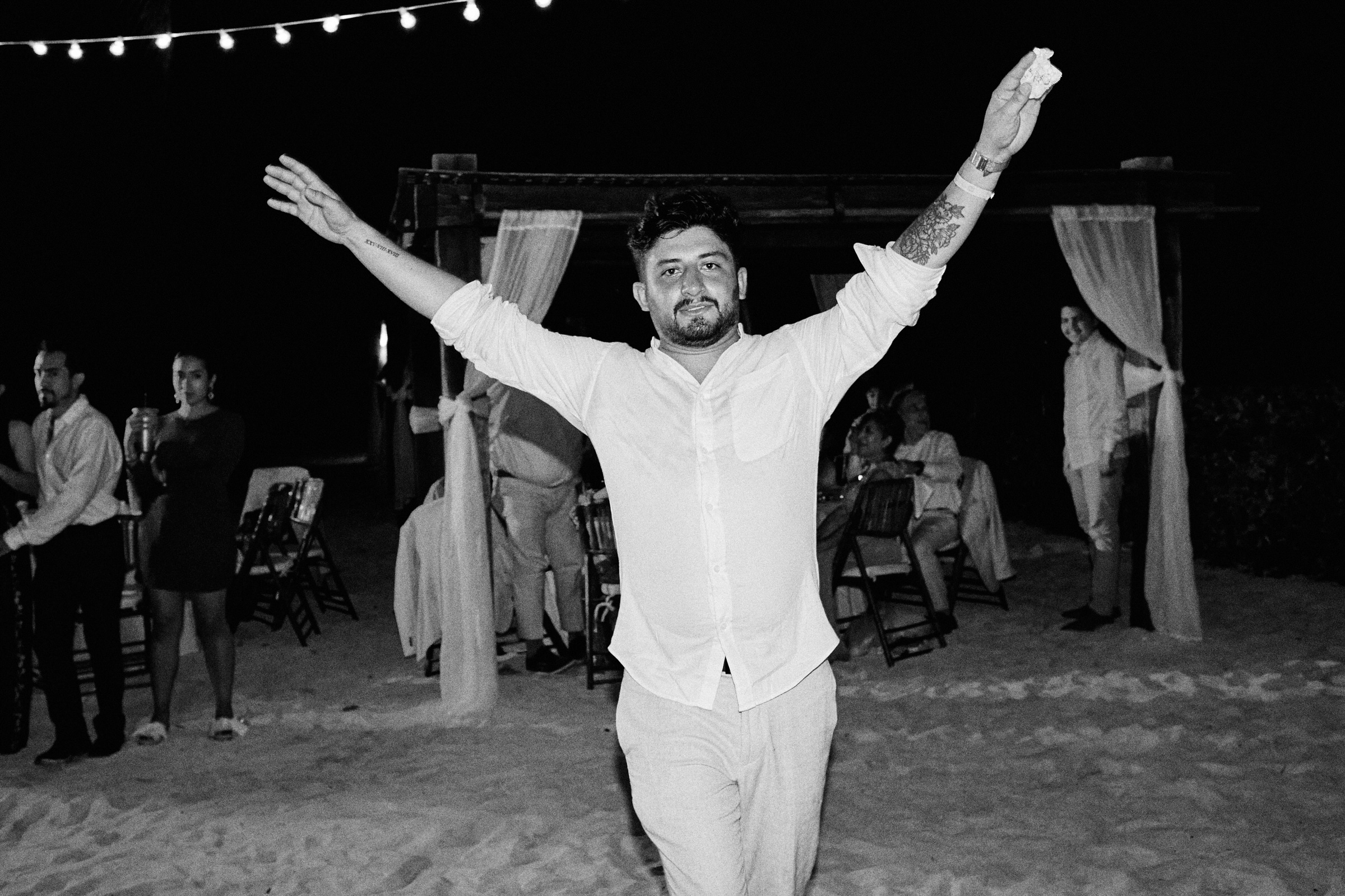 Groom at Wedding Reception in Black and White