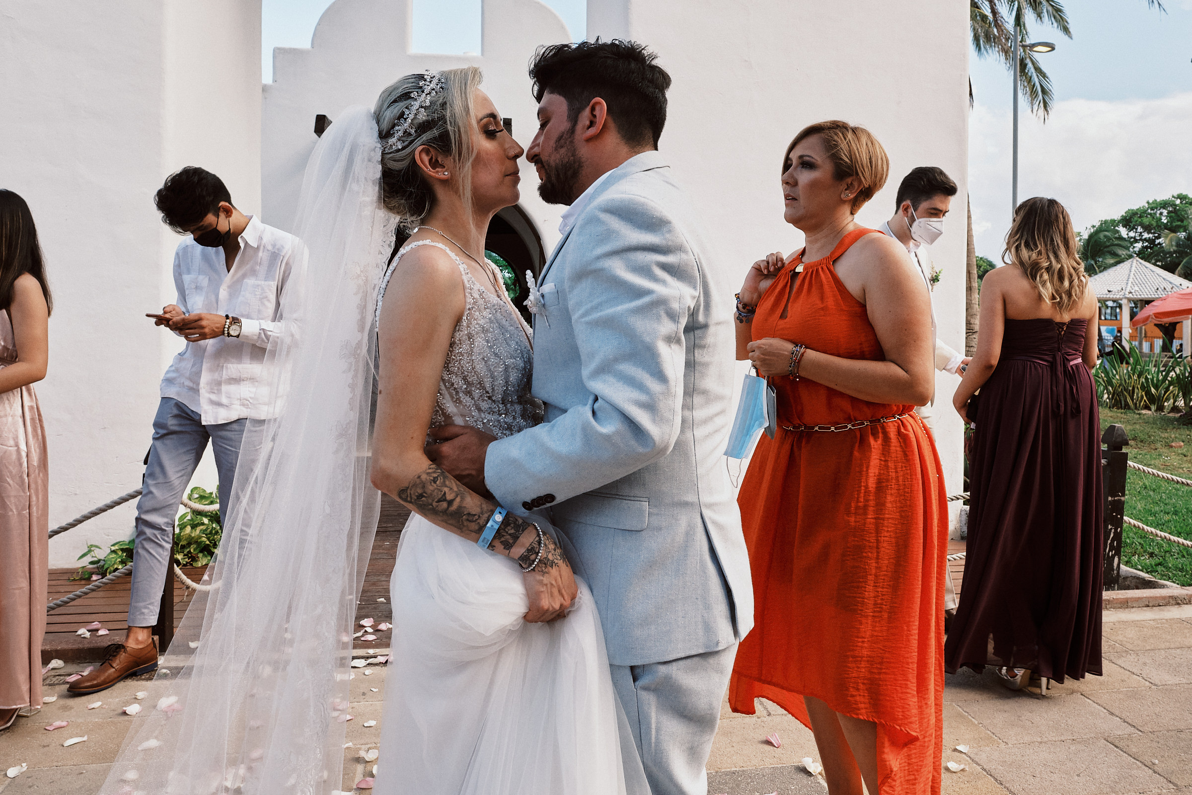 Bride And Groom Prepare To Kiss In Front Of Capilla Nuestra Señora Del Carmen After Wedding