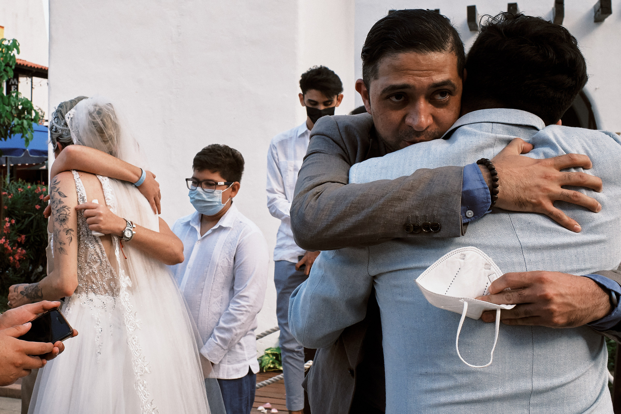 Guests Hug Bride And Groom After Catholic Wedding Ceremony In Playa Del Carmen