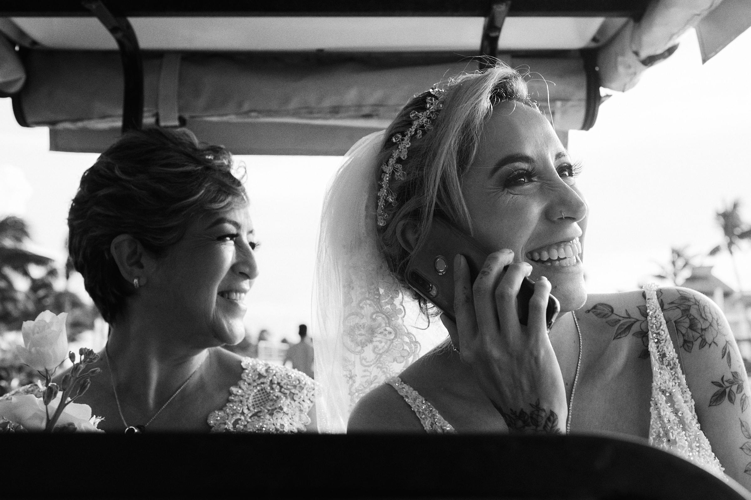 Bride Happily Talks On The Phone While In Golf Cart