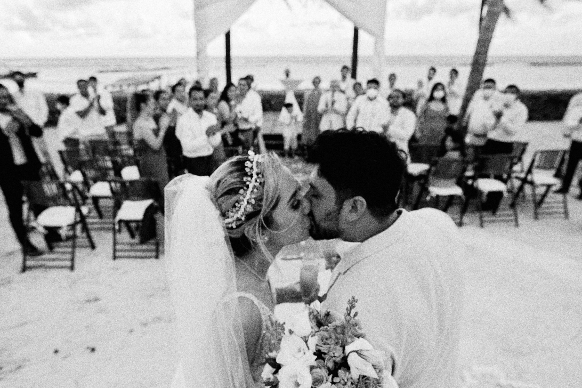 Black And White Blurry Image Of Couple Kissing