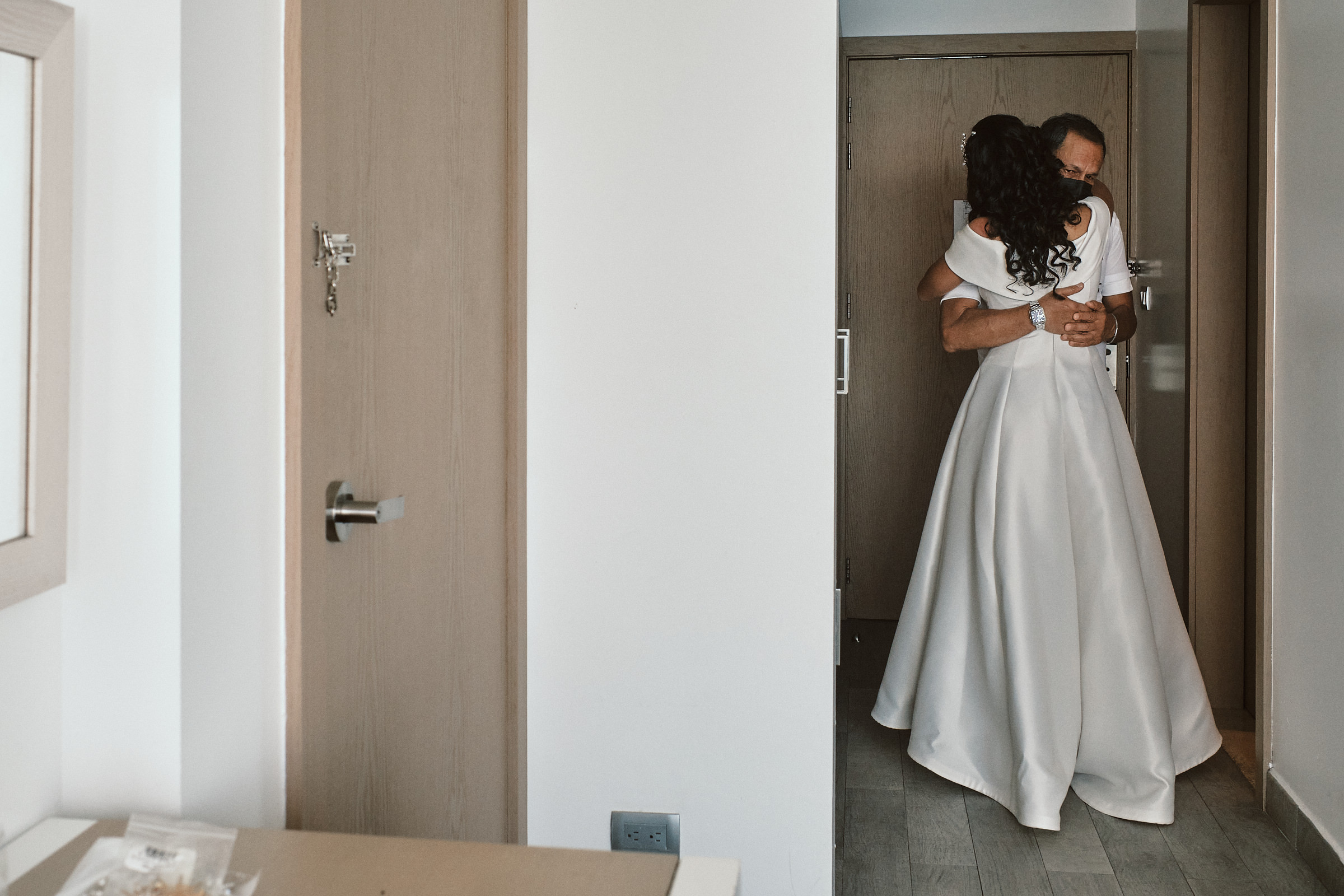 Bride Hugs Her Dad In Hotel Room At Doubletree Hilton In Mazatlan