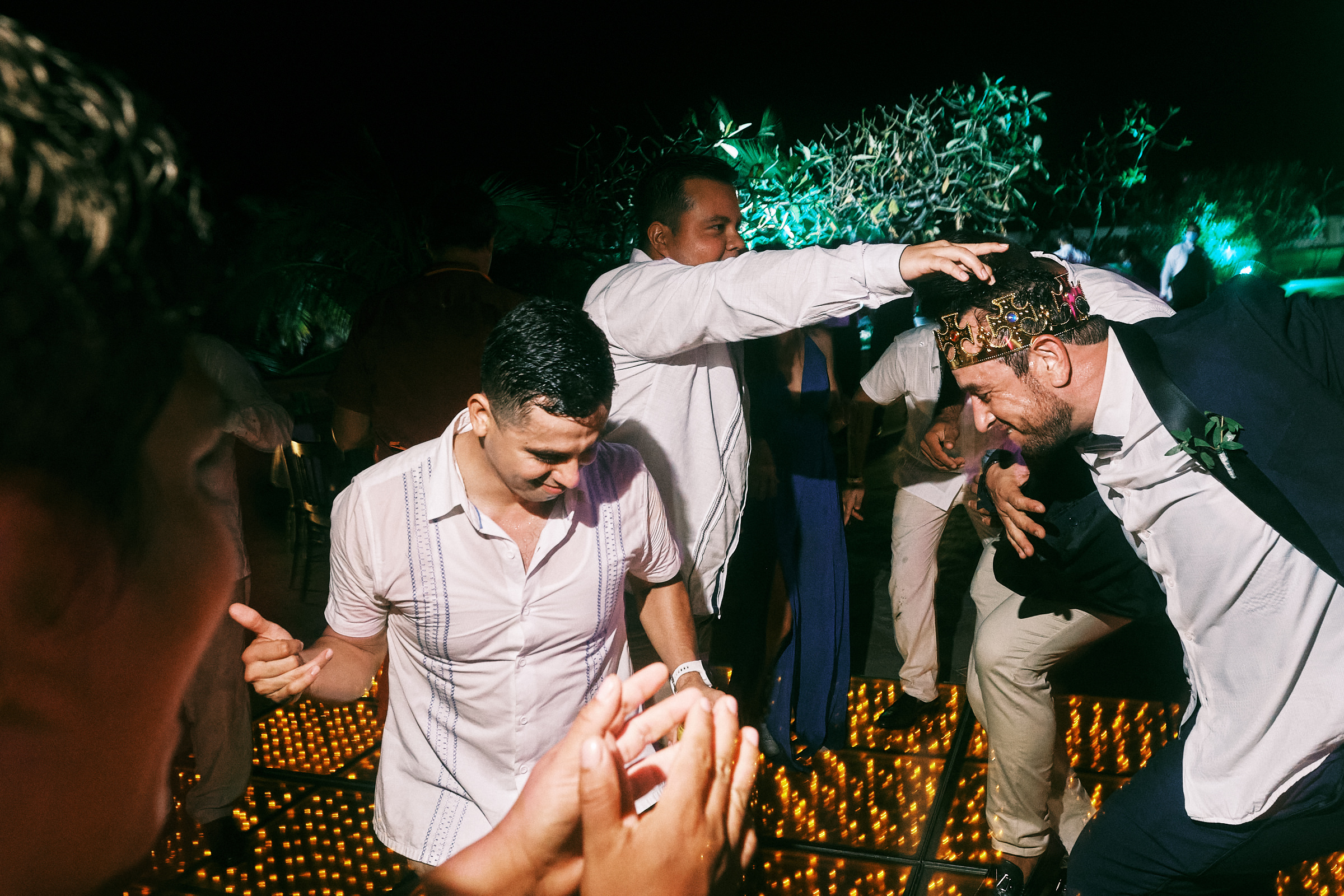Groom Dances With His Friend While Wearing A Crown