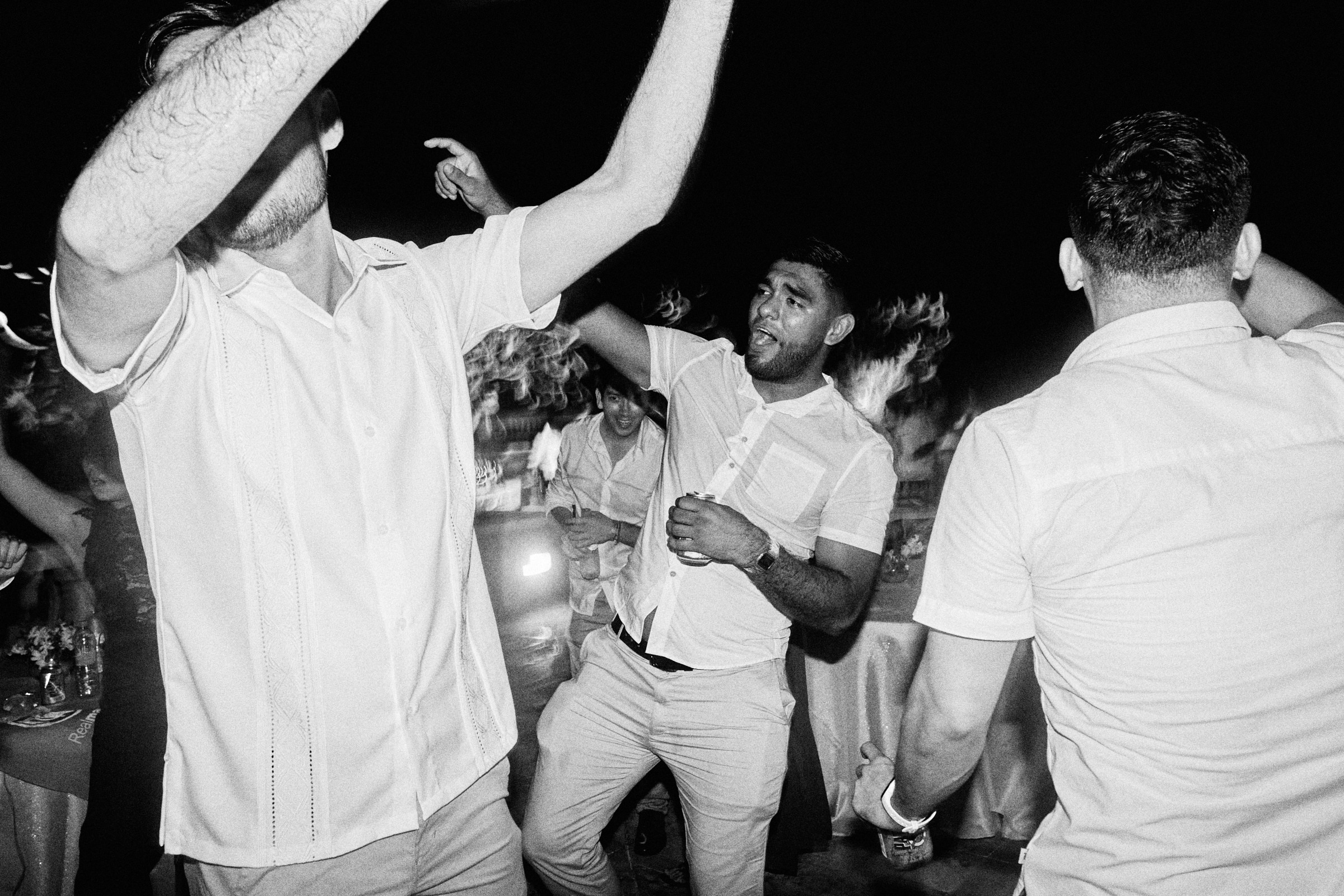 Black And White Photo Of Wedding Guests Dancing At Wedding In Mazatlan