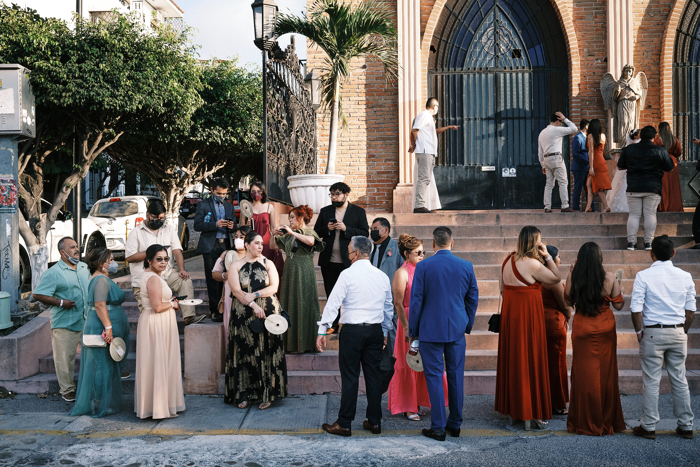 Wide Shot Of Wedding Guests Getting Ready To Leave Wedding Ceremony Location