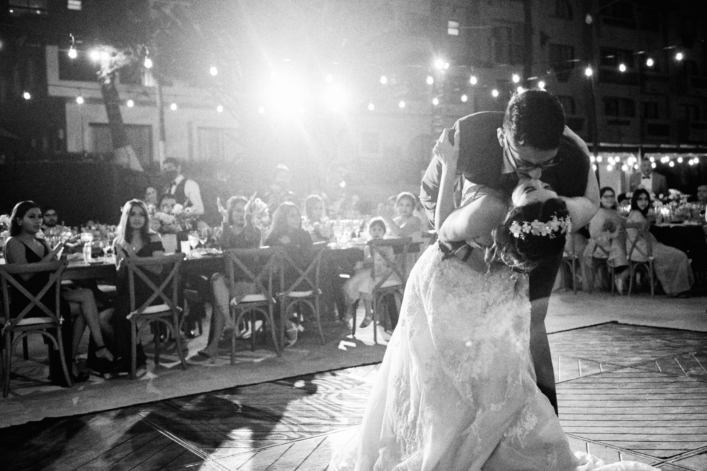 Groom Kisses Bride Photo In Black And White After The First Dance