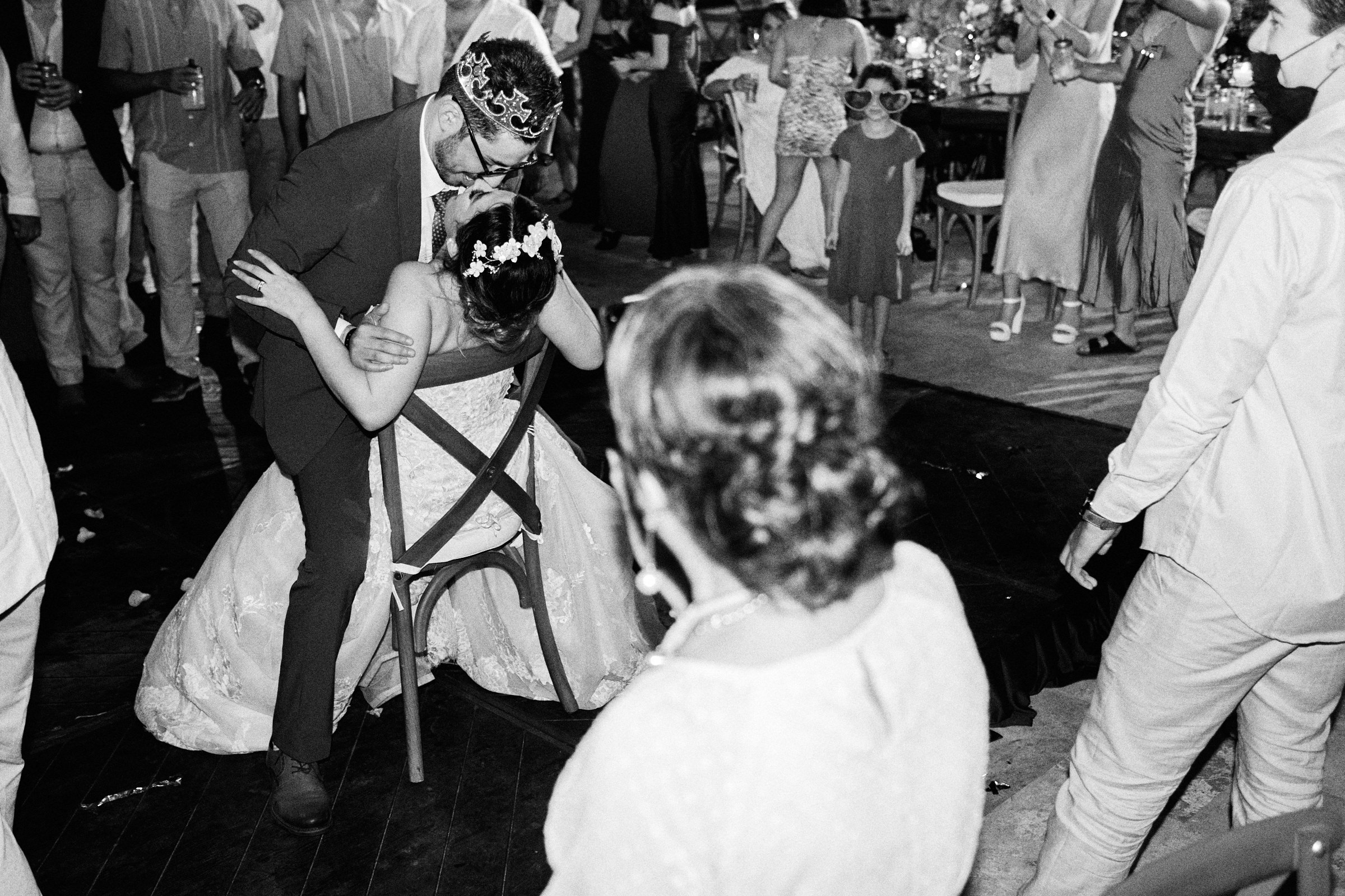Groom Has Fun With Bride As Young Girl Watches
