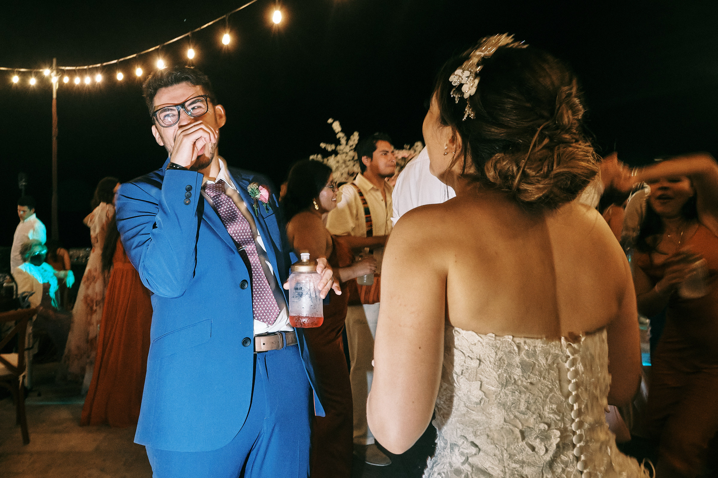 Groom Laughs In The Middle Of The Dance Floor
