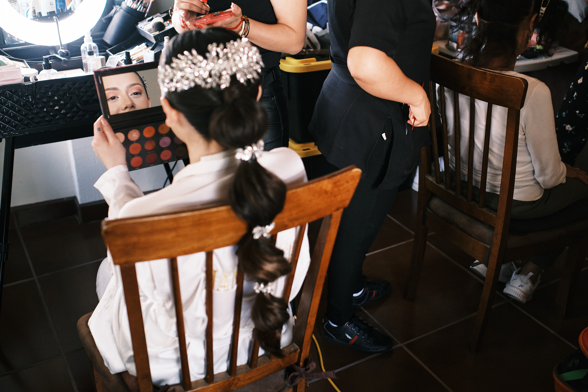 Bride Checks Her Makeup On The Mirror